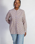 Model wearing linen top with small flower print.