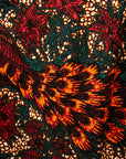 Close up display of orange, brown and green dress, fabric
