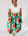 Model wearing multicolored geometric print skirt.