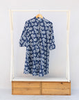 Display of blue and white floral print dress.