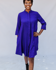 Model wearing deep blue linen dress.