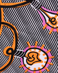 Close up display of black and white light bulb print dress, fabric.