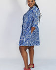 Model wearing blue and white zigzag print dress.