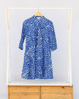 Display of blue and white zigzag print dress.