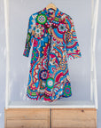 Display of rainbow mosaic print dress.