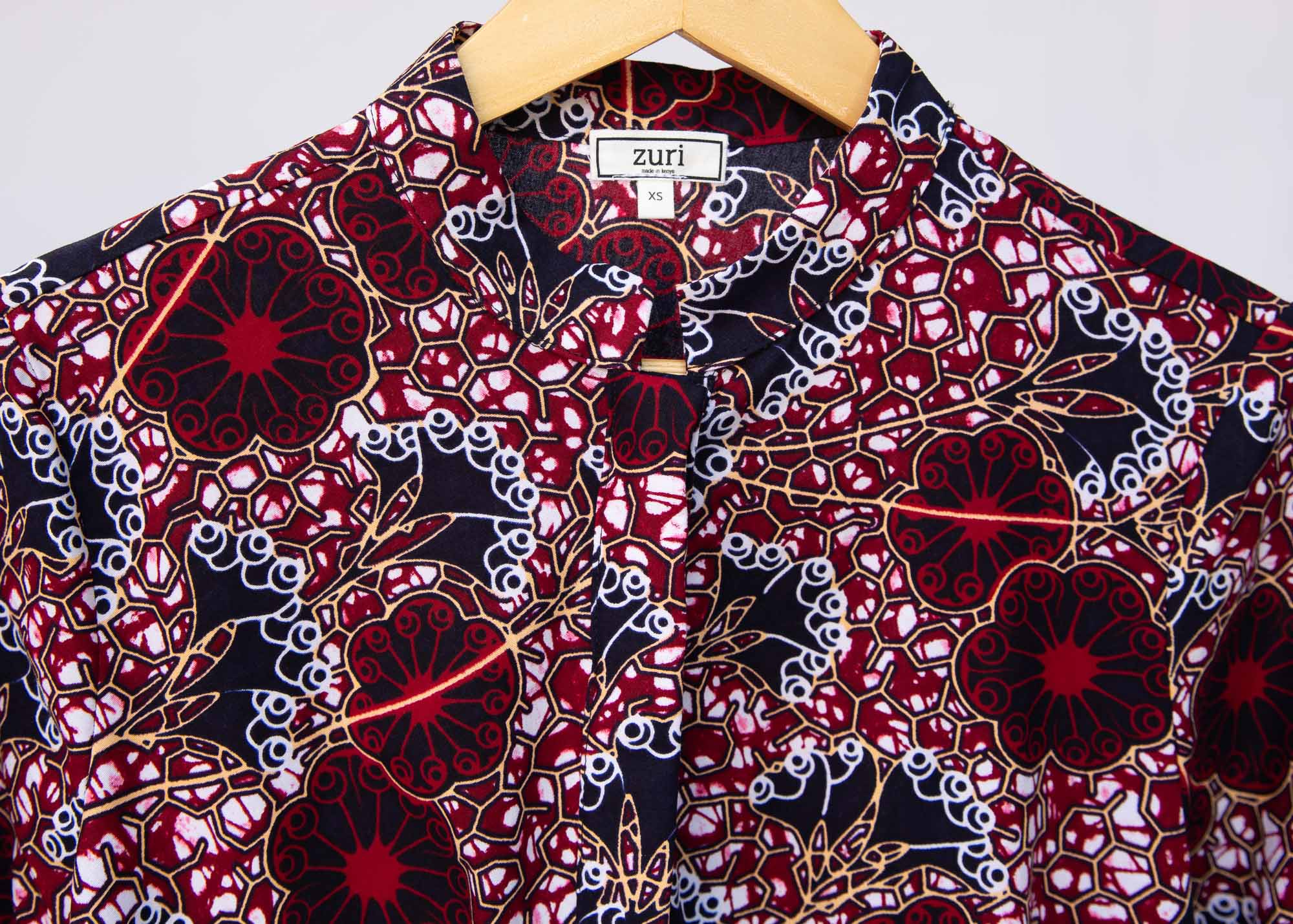 Display of burgundy, white and navy blue floral print dress