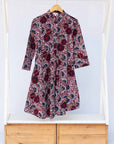 Display of burgundy, white and navy blue floral print dress