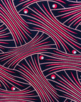 Close up display of coral, pink, white and navy blue colored dress, fabric