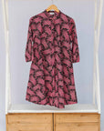 Display of coral, pink, white and navy blue colored dress