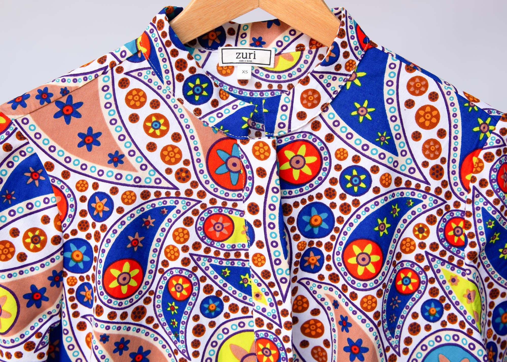 Display of multi-colored paisley print dress