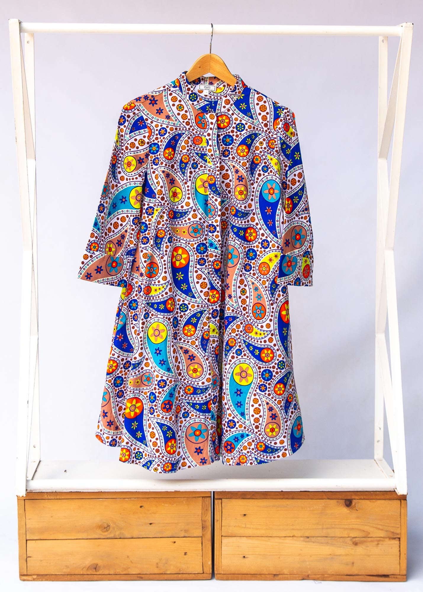 Display of multi-colored paisley print dress