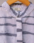 Display of gray and white striped batik shirt