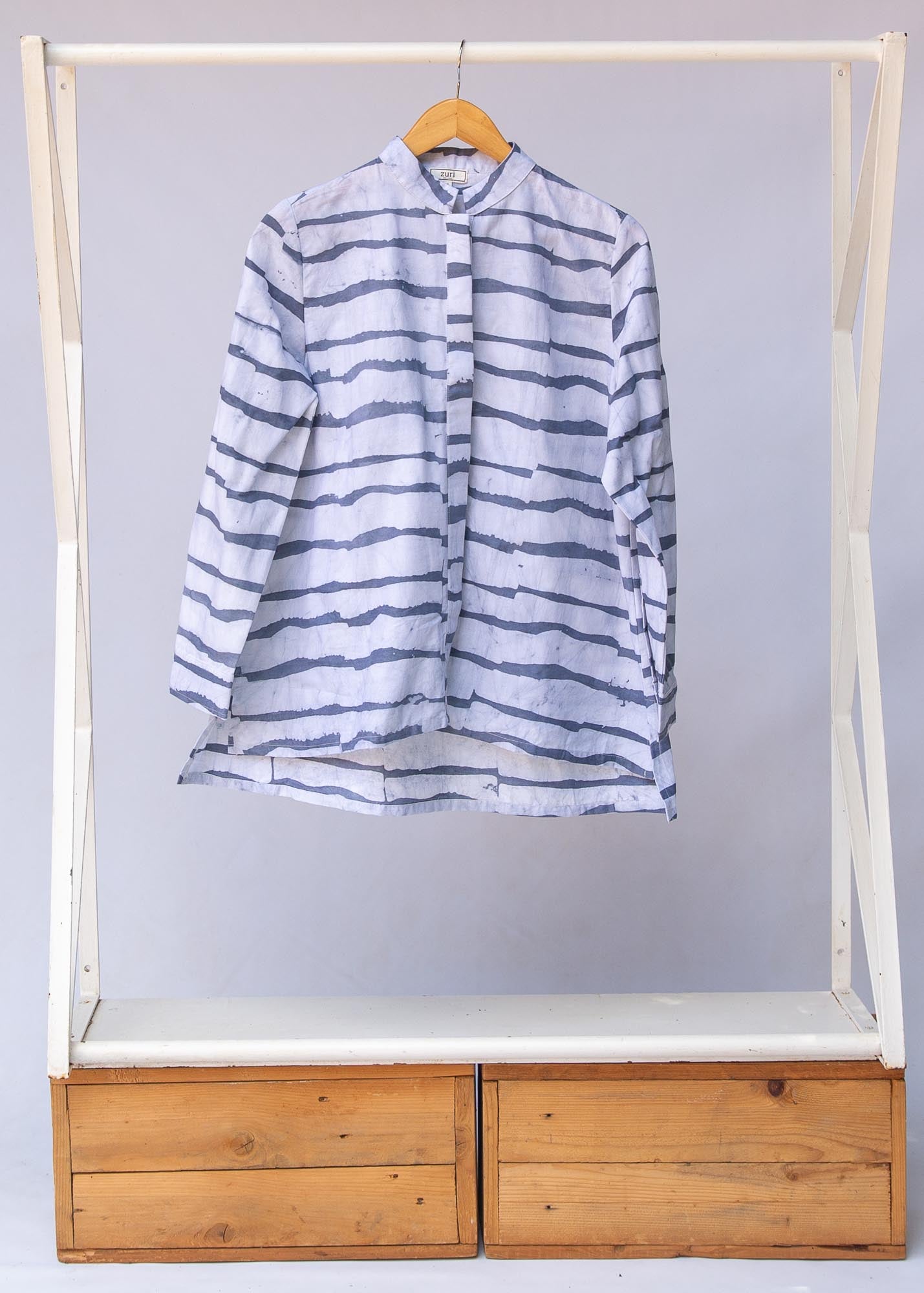 Display of gray and white striped batik shirt