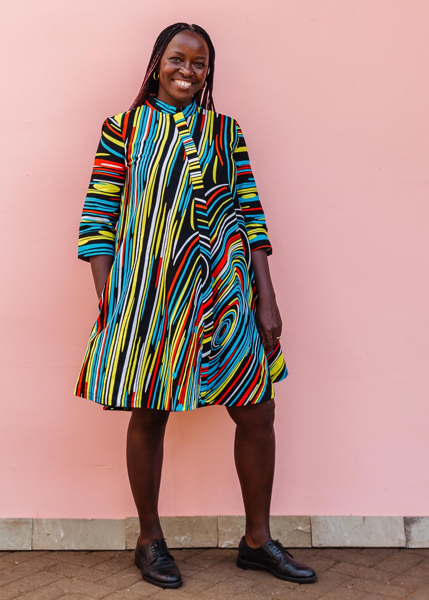 The model is wearing pop art colored geometric print