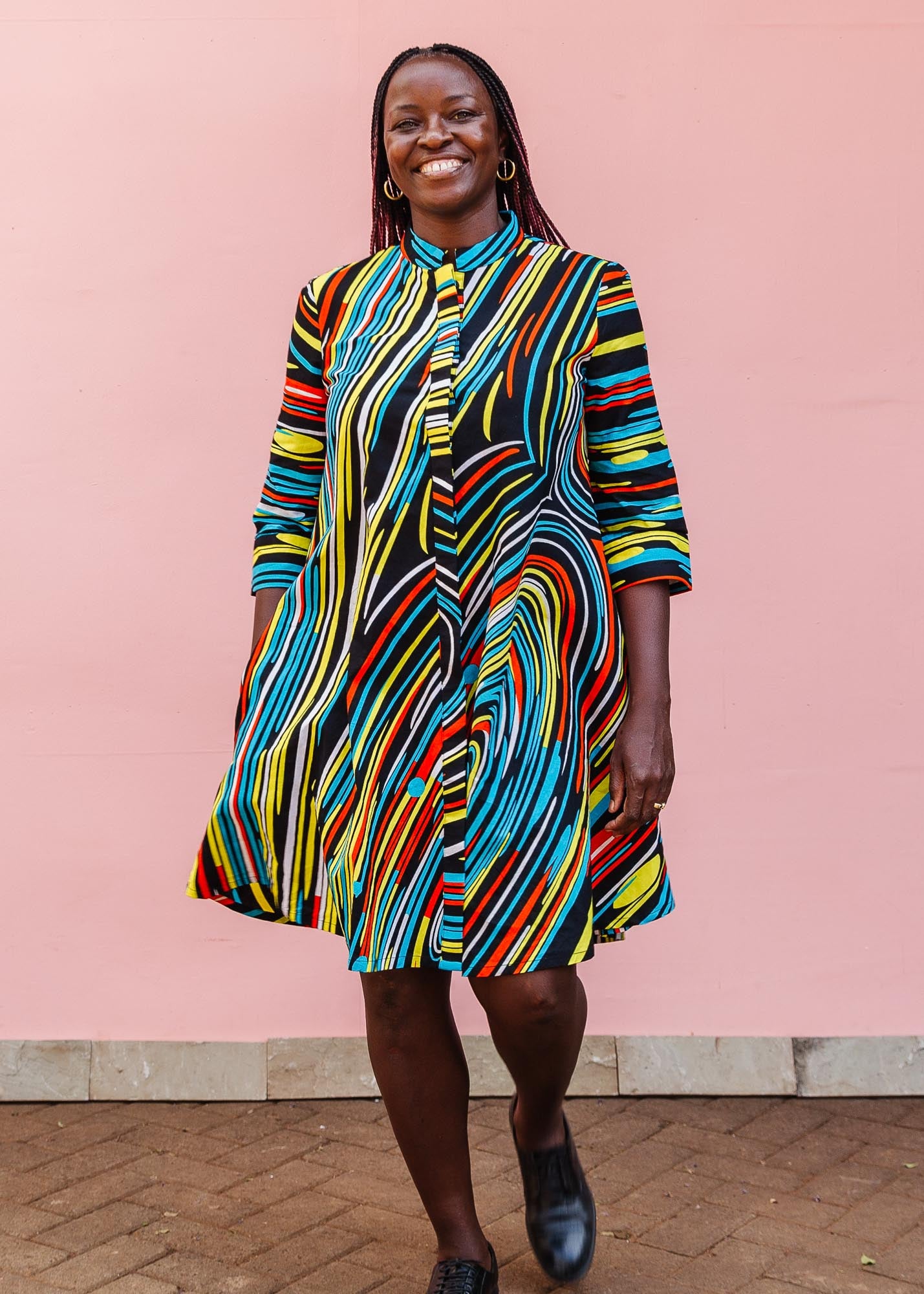 The model is wearing pop art colored geometric print