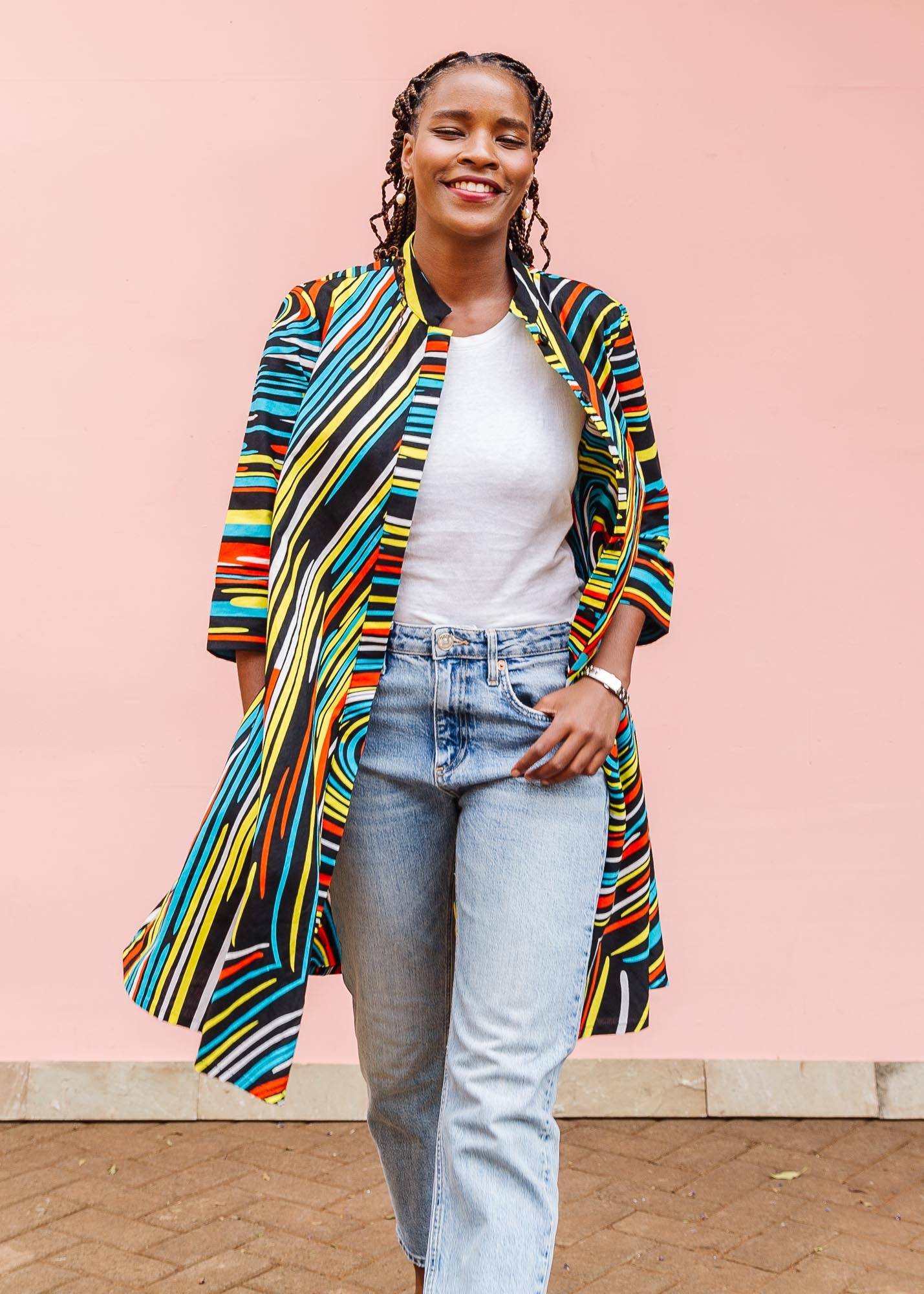 The model is wearing pop art colored geometric print