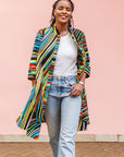 The model is wearing pop art colored geometric print