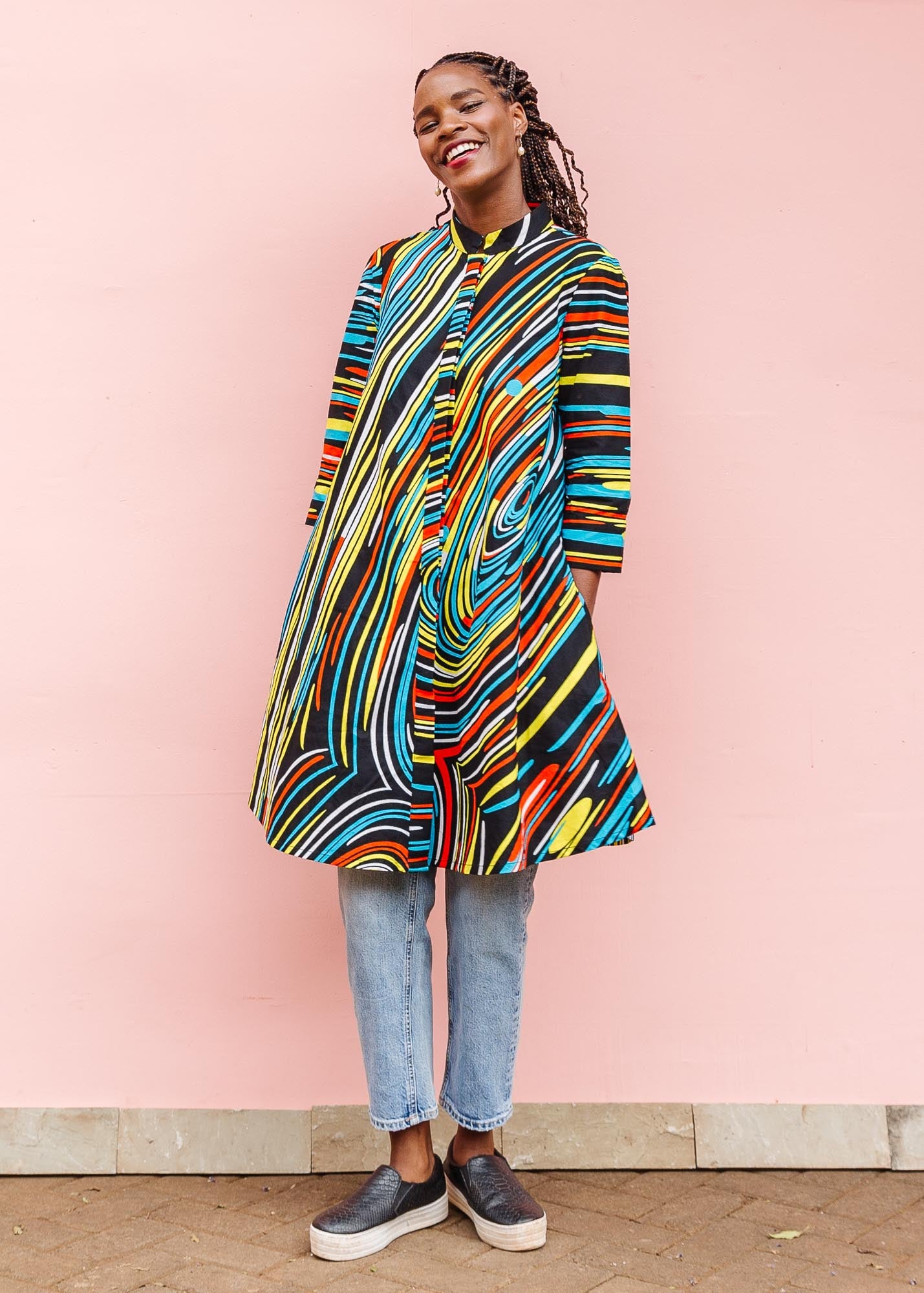 The model is wearing pop art colored geometric print