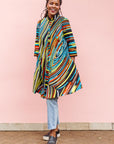 The model is wearing pop art colored geometric print