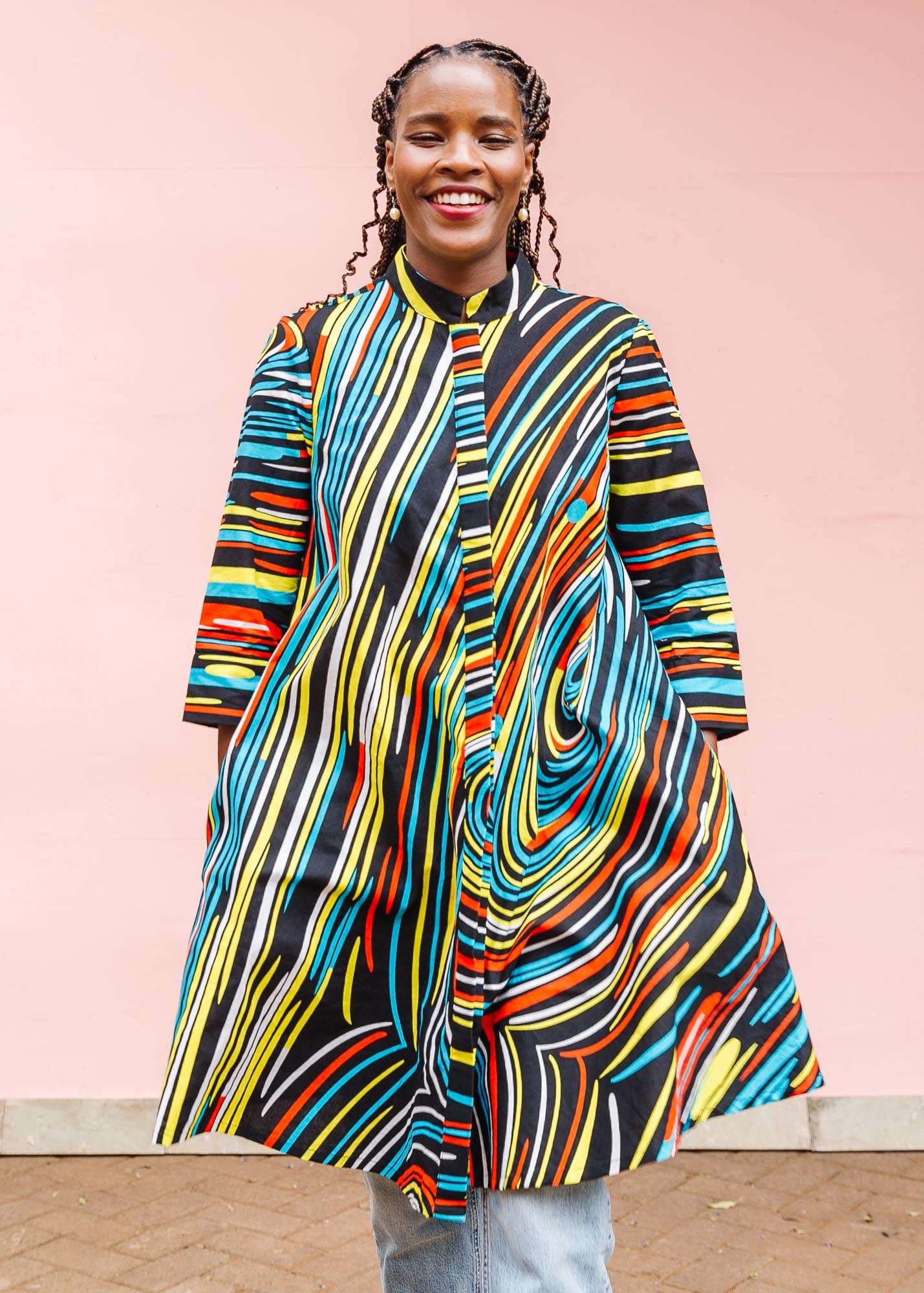 The model is wearing pop art colored geometric print