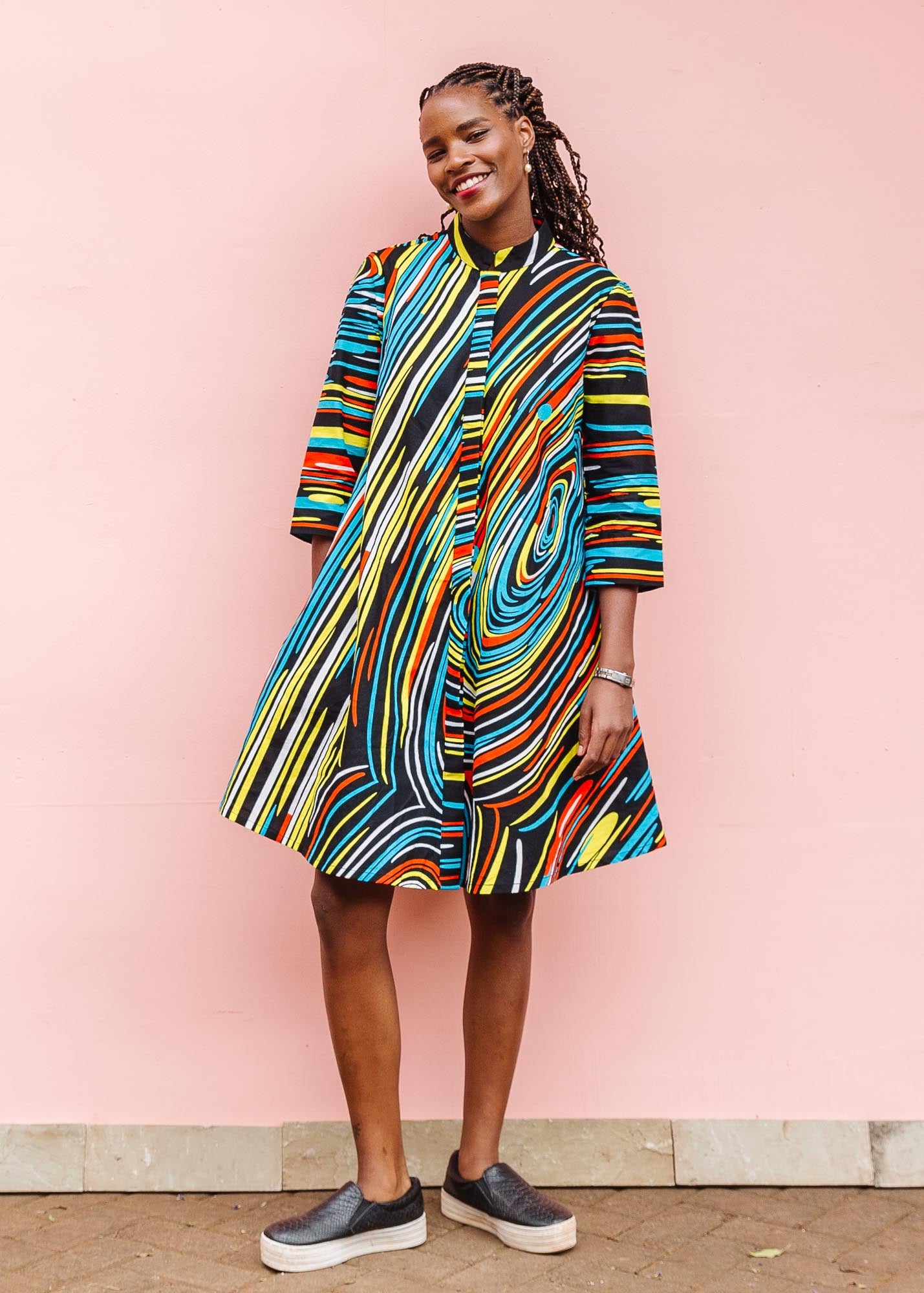 The model is wearing pop art colored geometric print