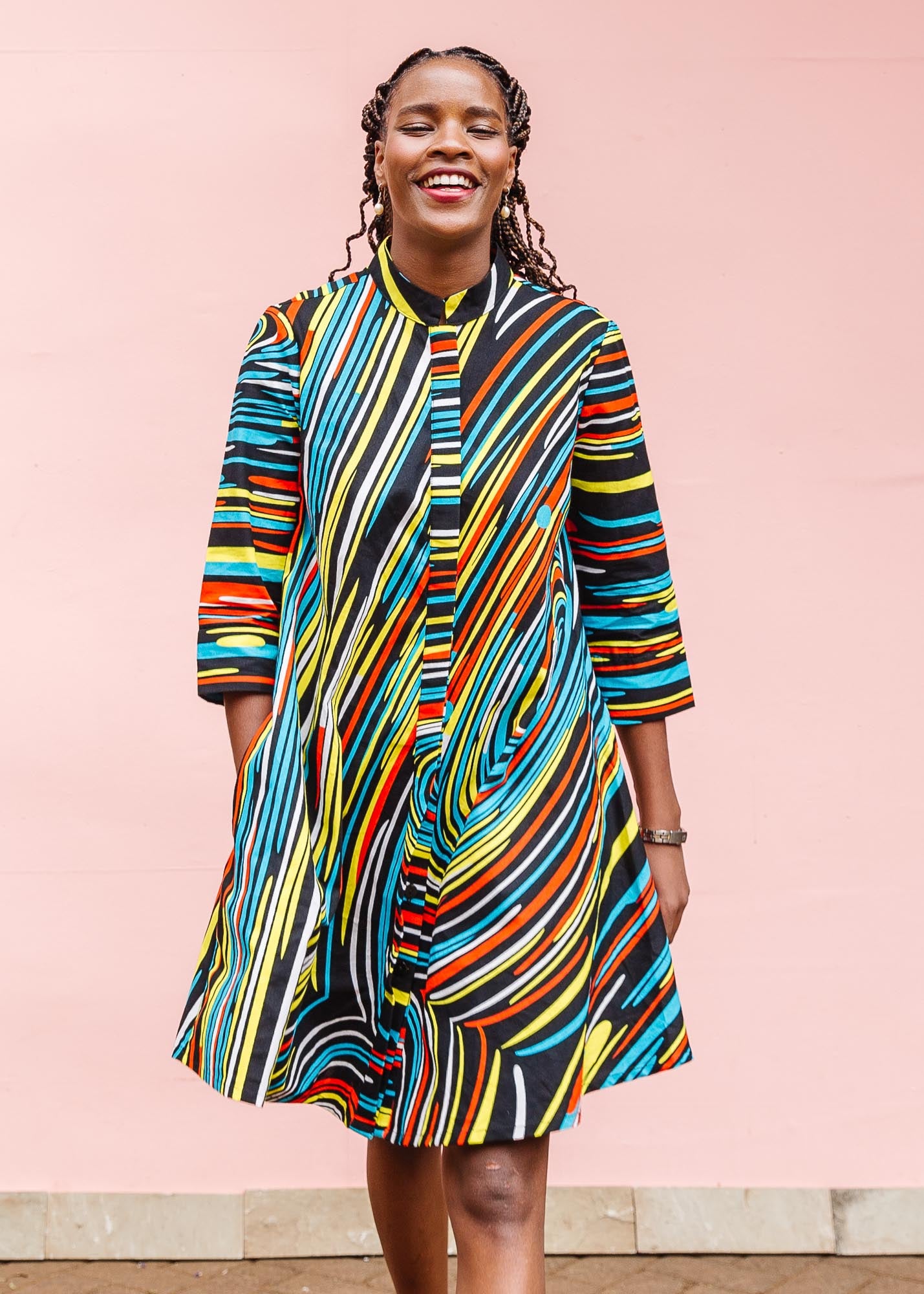The model is wearing pop art colored geometric print