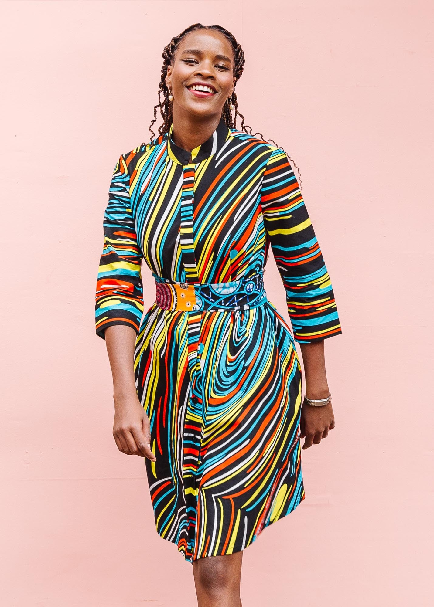 The model is wearing pop art colored geometric print