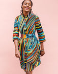 The model is wearing pop art colored geometric print