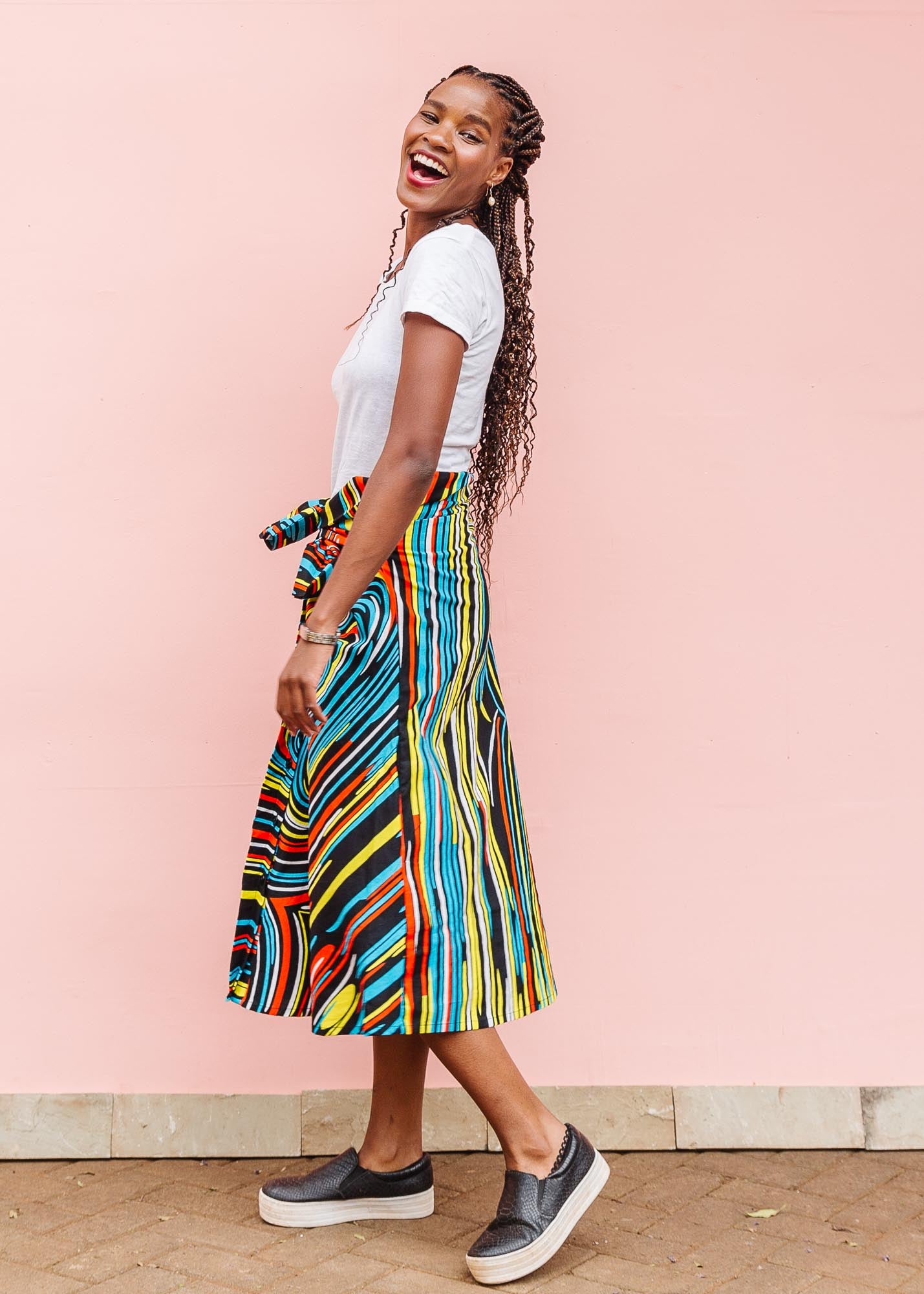 The model is wearing pop art colored geometric print
