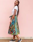 The model is wearing pop art colored geometric print