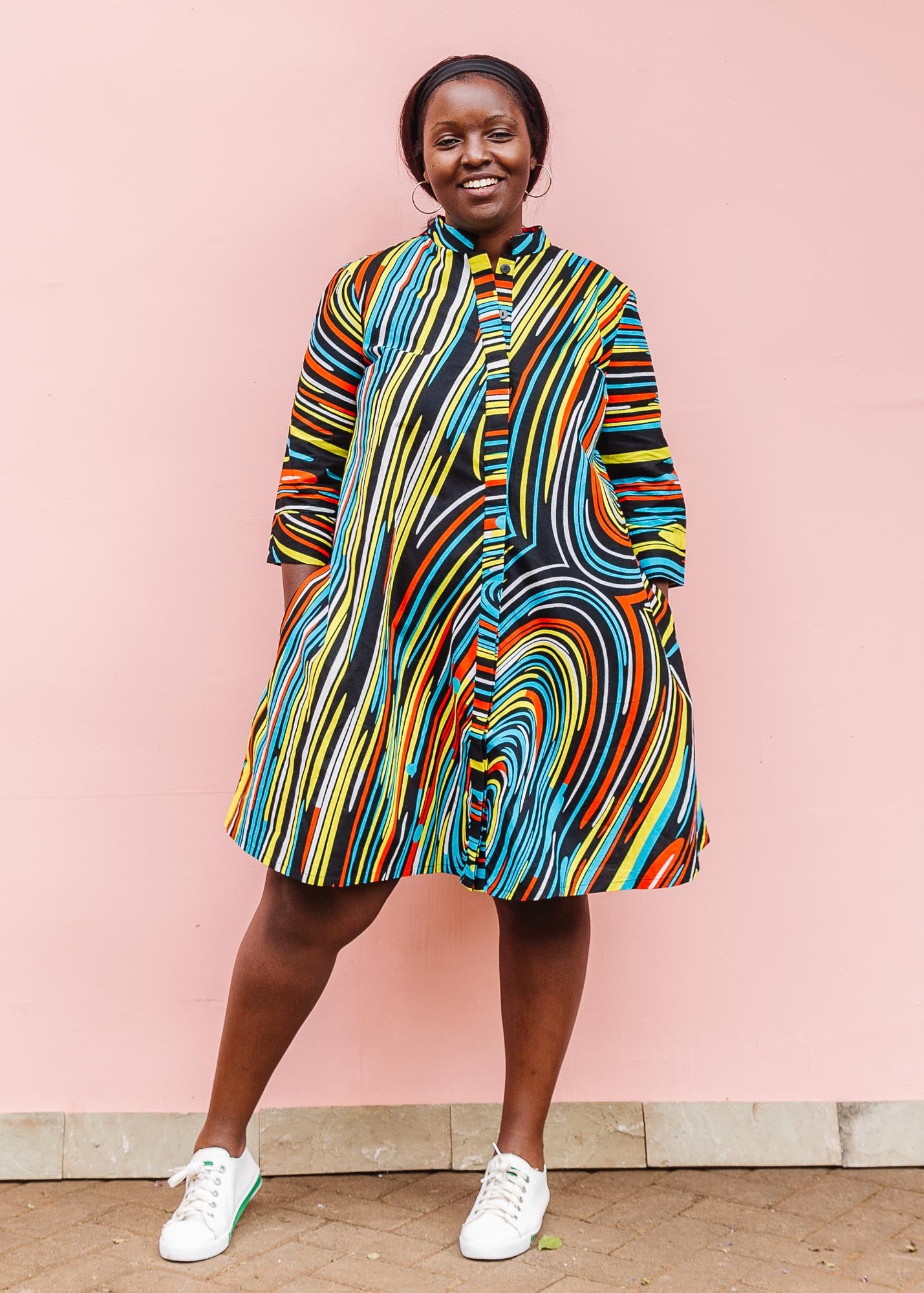 The model is wearing pop art colored geometric print
