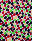Close up display of multi-colored scallop tiles print dress