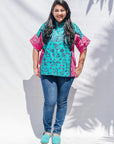 The model is wearing black, pink, sky blue, white, purple print shirt