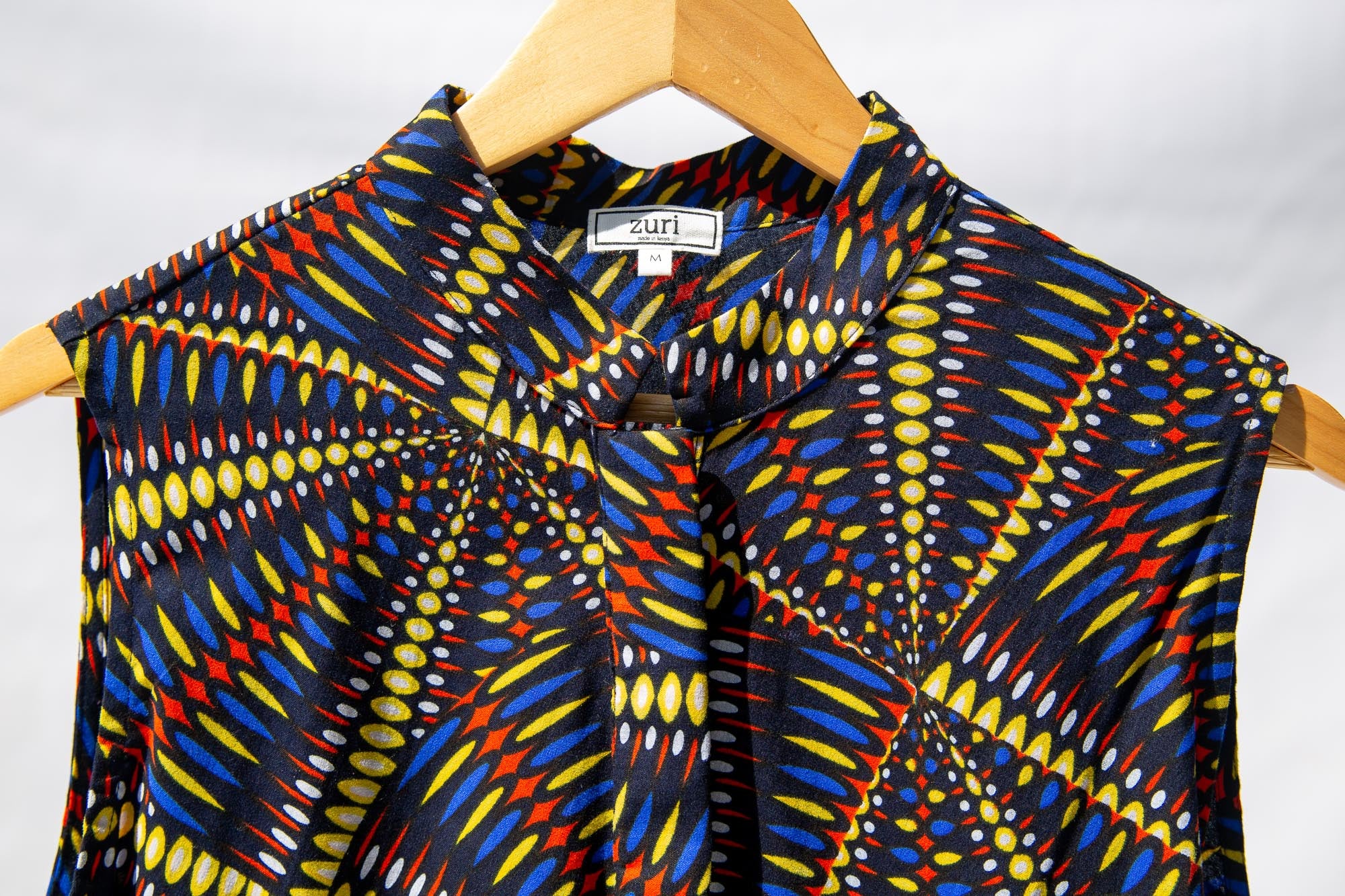 Display of  multi-colored abstract print dress