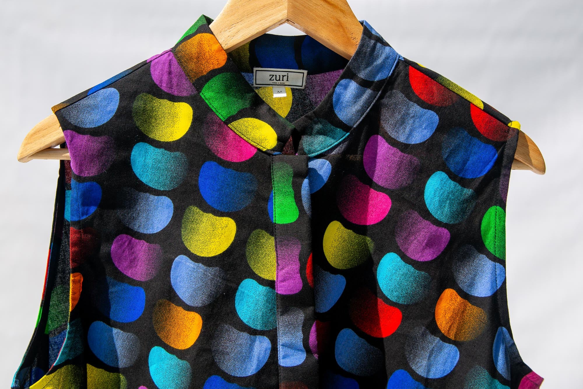 Display of black dress with colorful panel