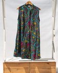 Display of black, yellow, blue, red, pink print dress