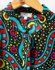Display of black, yellow, blue, red, pink print dress