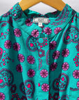 Display of black, pink, sky blue, white, purple print shirt
