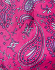 Close up display of black, pink, sky blue, white, purple print shirt