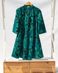 Display of black, blue, green print dress