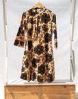 Display of navy, black, off white, yellow flower print dress