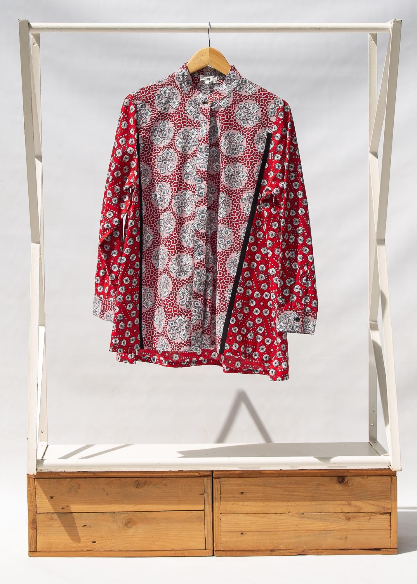 Display of red, black, white print shirt