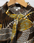 Display of black, brown, yellow, beige print dress