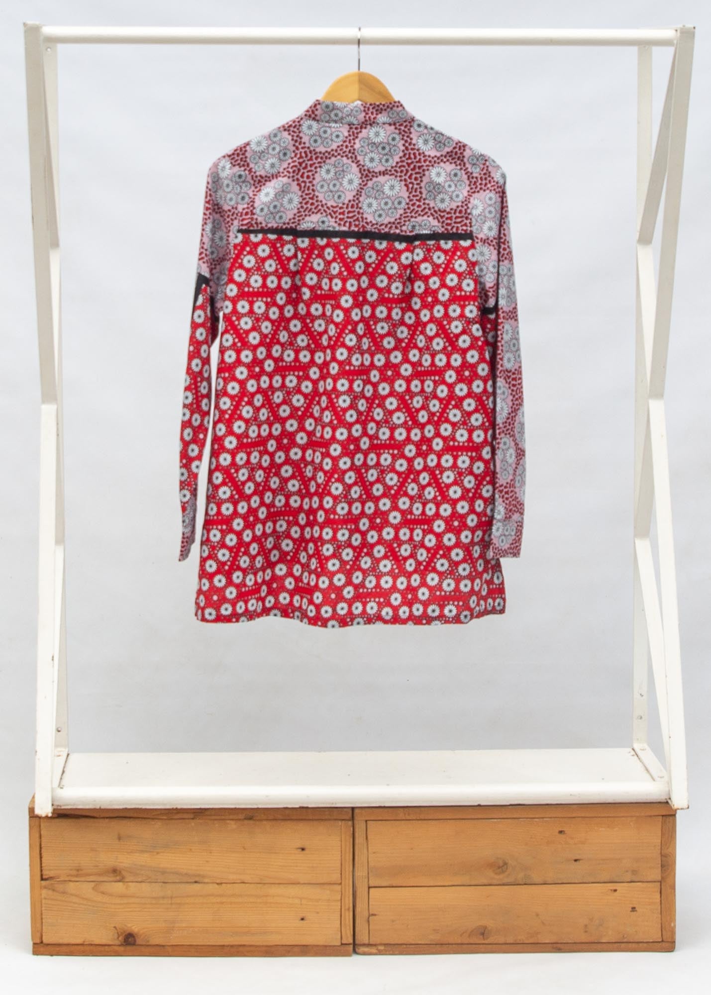 Display of red, black, white print shirt