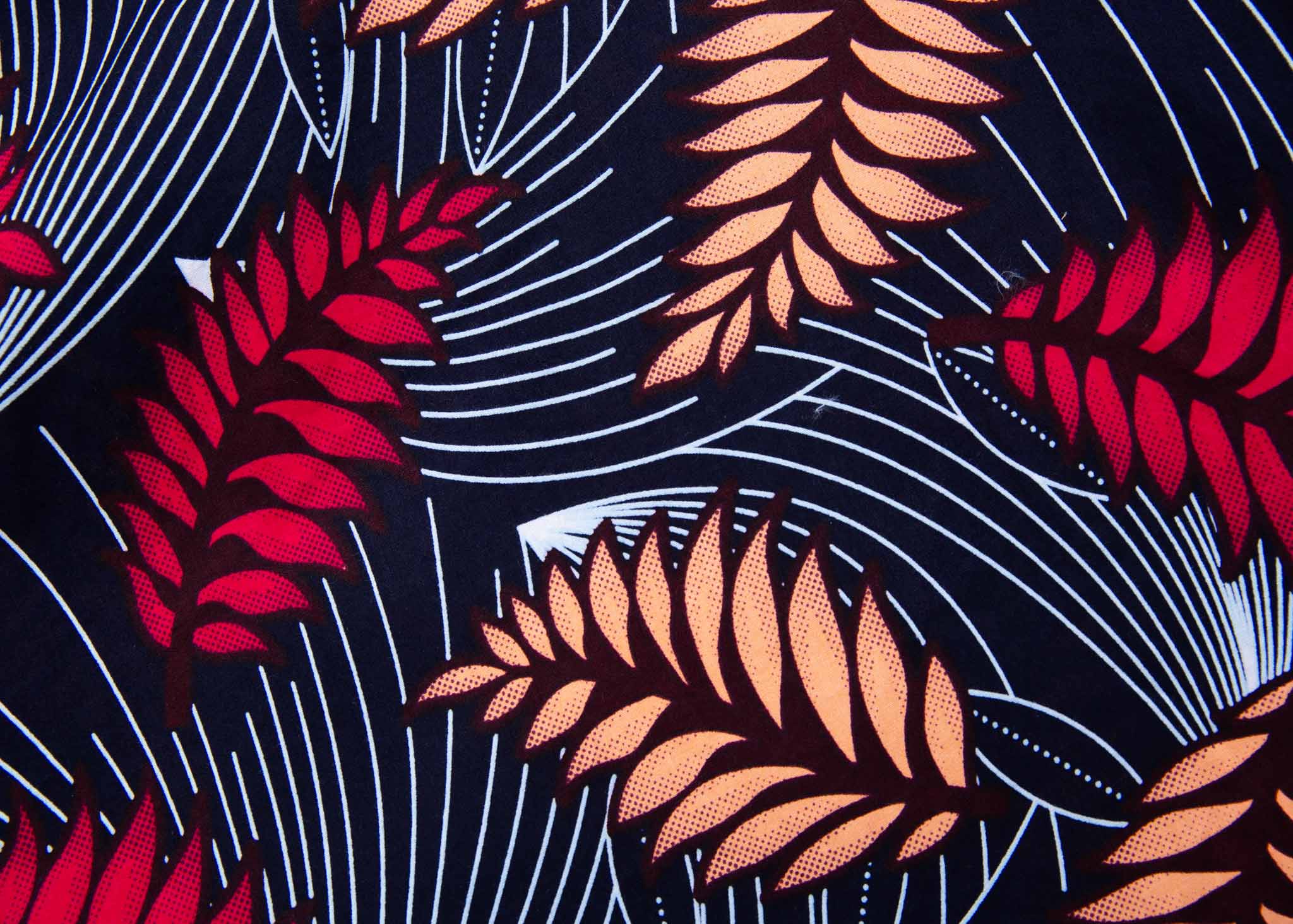 Display of navy dress with pink and peach feather print.