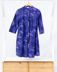 Display of purple dress with octopus print.