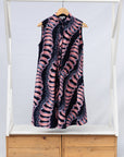 Display of black and pink sleeveless print dress.