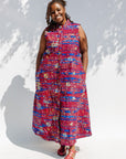 Model wearing a red and blue graphic print sleeveless dress.