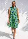 Model wearing sleeveless dress with green and blue snail print.