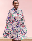 The model is wearing multi-colored floral print